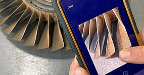  A smartphone is used to capture a finding on a turbine blade. 