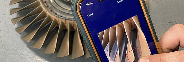  A smartphone is used to capture a finding on a turbine blade. 