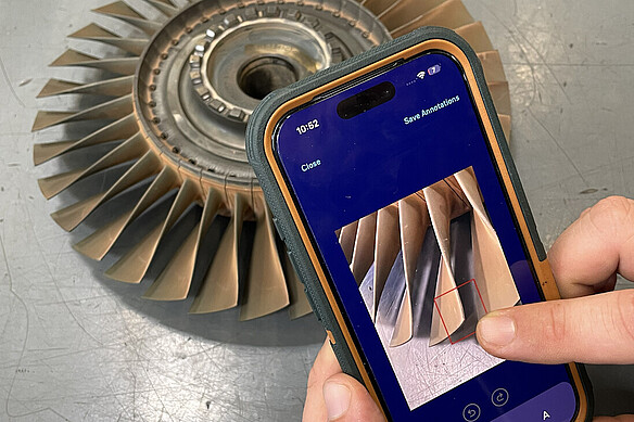  A smartphone is used to capture a finding on a turbine blade. 