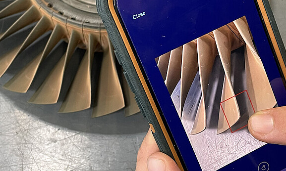  A smartphone is used to capture a finding on a turbine blade. 